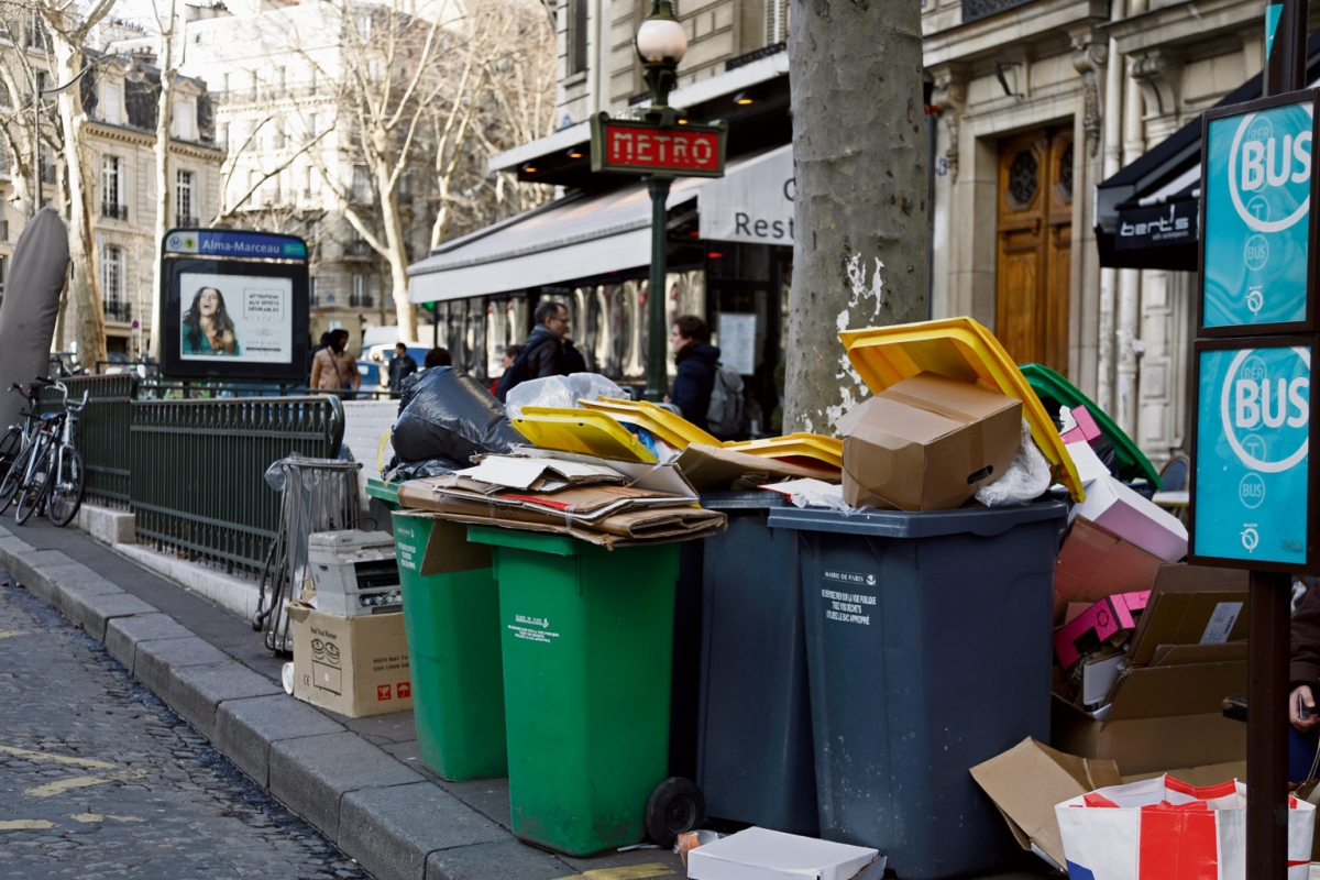 Overflowing trash bins are seen near a metro station as waste incineration plants go on strike in Paris, France
